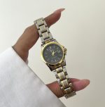 ساعت کاسیو زنانه تقویم دارصفحه مشکی بند سیلور طلایی