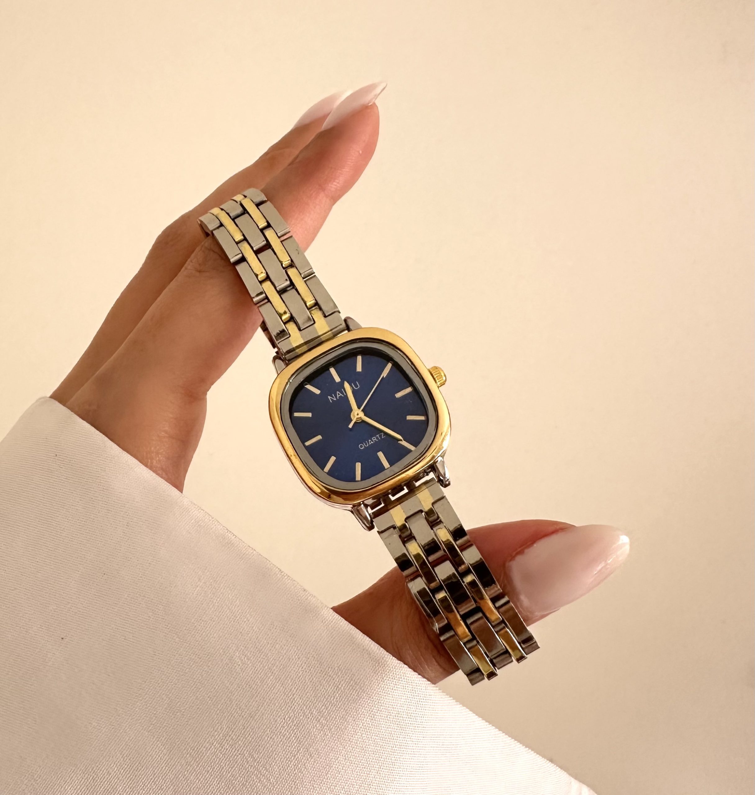 IMG_4206 ساعت نایدو سیلور گلد صفحه سورمه ای بند حصیری - Image 1