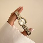 ساعت نایدو سیلور گلد صفحه سفید بند حصیری